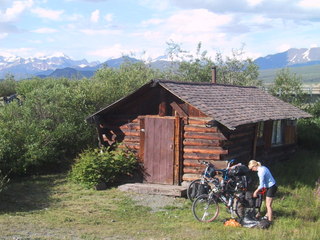 (picture: a rustic log cabin)